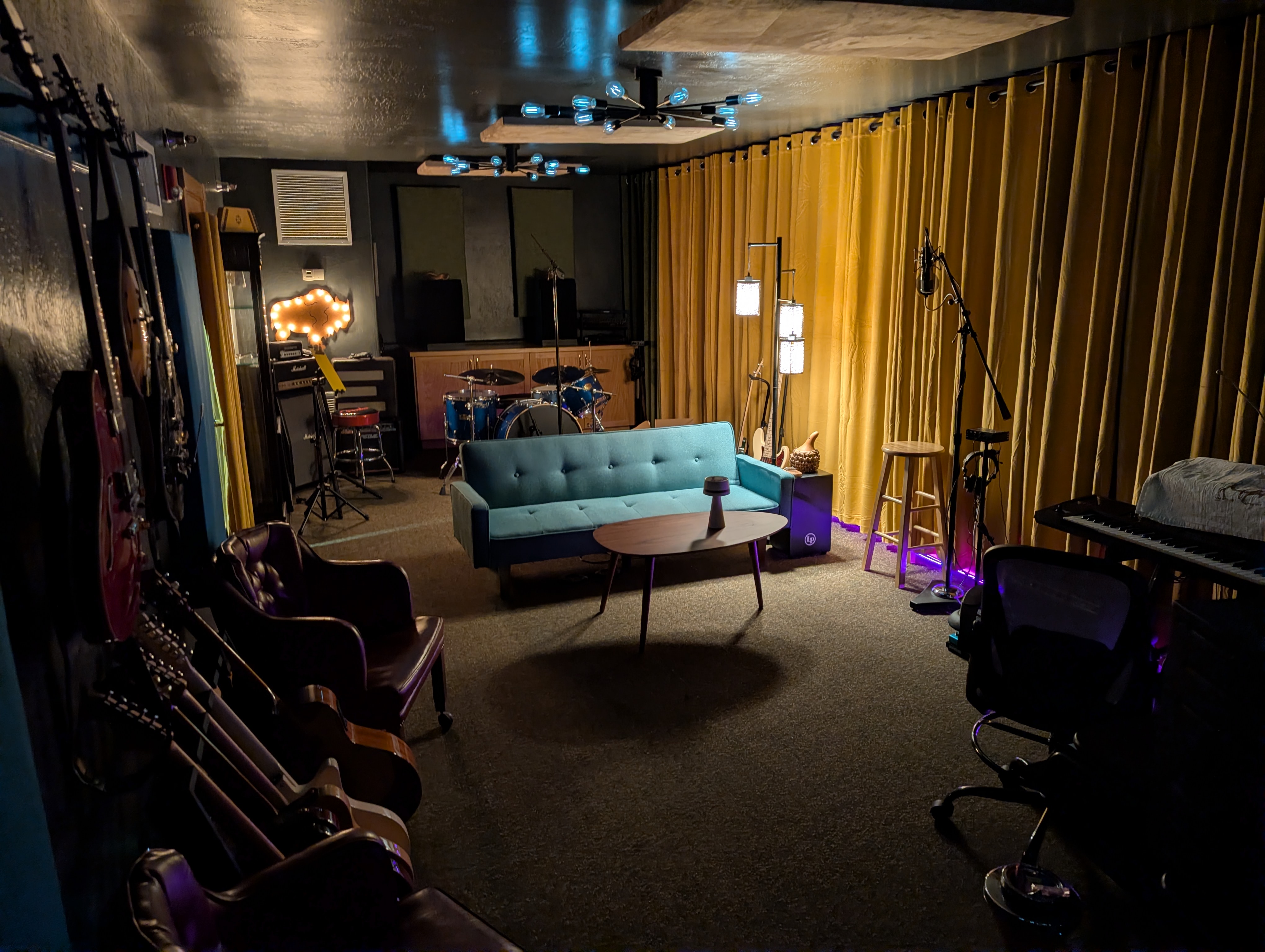 Giant Juniper Studio tracking room with instruments, microphones, and seating